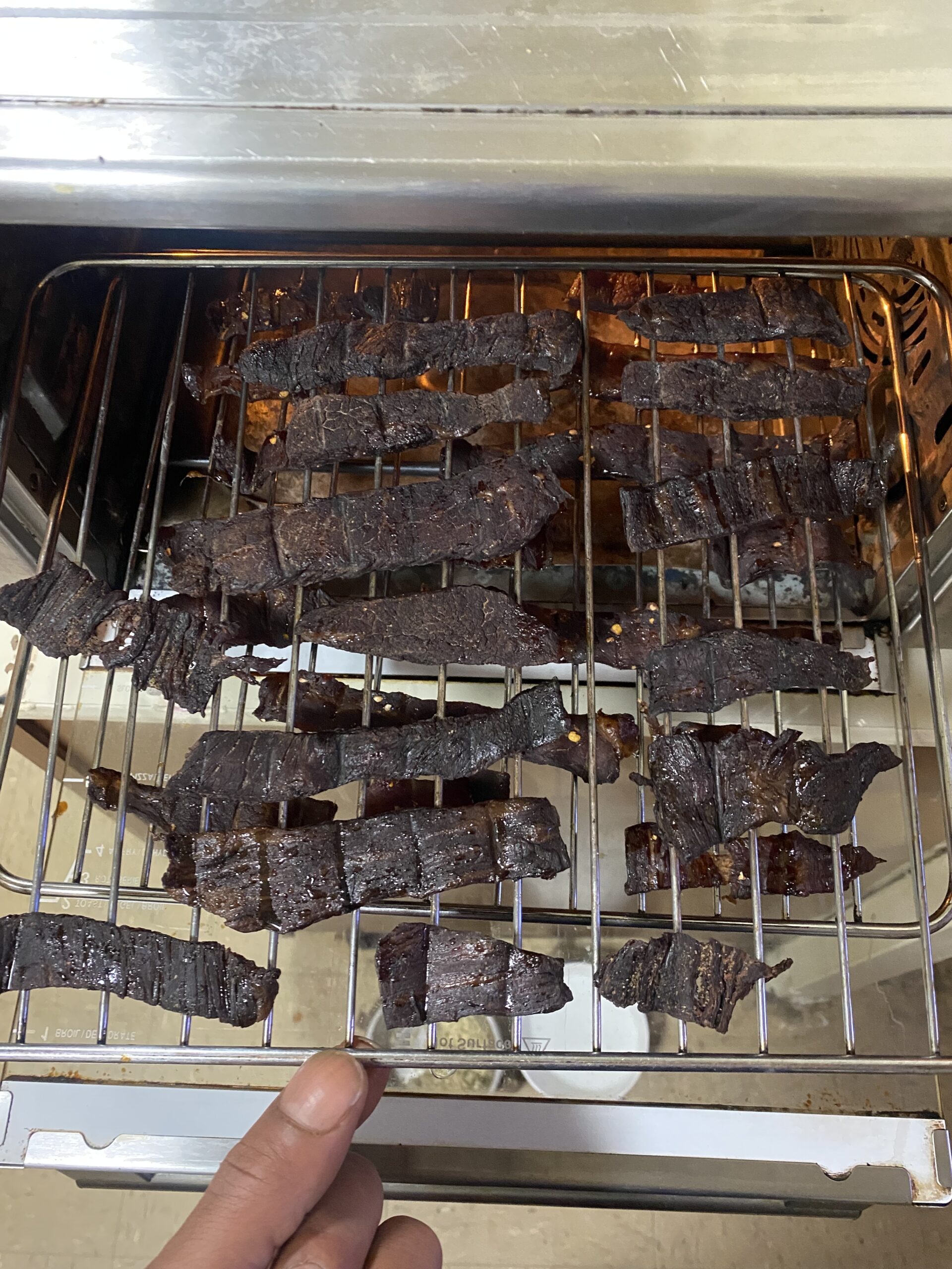 Blacksmith Beef Jerky being hand-cut and wood-smoked in small batches